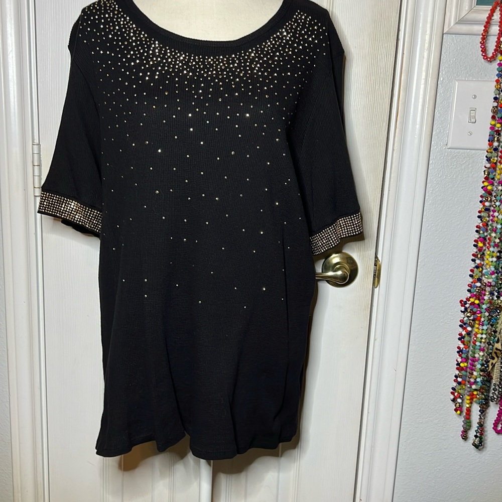 Vocal, with tiny stud embellishments.